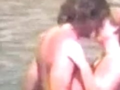 Naked couple at beach - voyeur video