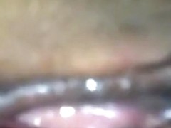 Closeup below view of a girl getting doggystyle fucked with condom