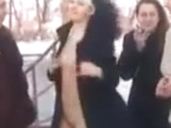 Two girls flashing in the snow