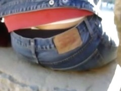Cute bitch in tight jeans gives a peek of her ass