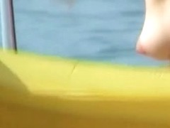 Hot pointy tits and a girl with a shaved head in this beach video