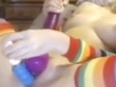 Girl in stockings mastrubating with magic wand and dildo