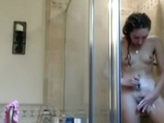 girl captures herself showering and shaving her pussy