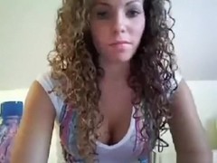 Very hot curly haired brunette girl masturbates with a vibrator