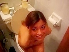 Busty teen in bathroom voyeur