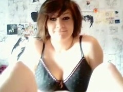 Brunette girl plays with her big tits and trimmed pussy on her bed