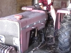 Sexy girl masturbating on a tractor