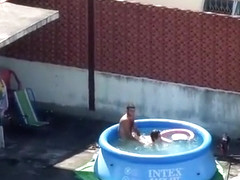 Doggystyle screwing outdoors in the pool
