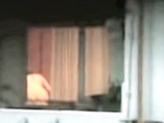 Horny neighbor nude and voyeured through window