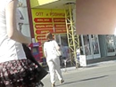 Public upskirt view presents charming red panties