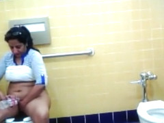Thick Mexican woman piddles and washes her genitals in the restroom