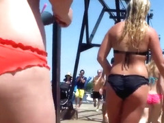 Big female booty in an orange bikini is breathtaking