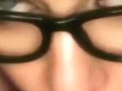 Girl with glasses blows her boyfriend