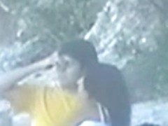 teen couple caught on the beach