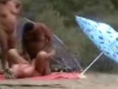 Two mature couples having fun at nude beach