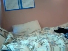 girl takes off her panties after a long day at school and plays with a toy on her bed
