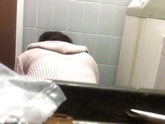 Female bent over the bowl and shot on the toilet cam