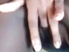 Dark woman having fun with dildo