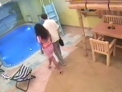 Couple pairing off in pool