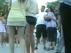 Couple of smokin brunettes in an upskirt public square ass video