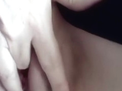 Fingering her shaved pussy closeup
