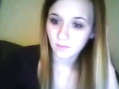 Brunette girl masturbates with a small vibrator on her bed