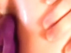 Enjoying a double penetration with one of her toys