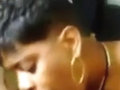 Ebony Woman Sucking On Some Big Cock