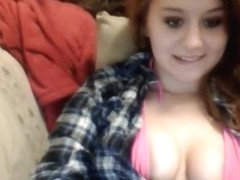 Cute brunette girl shows off her goods on the sofa