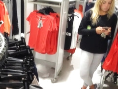 Candid voyeur hot blonde in leggings shopping