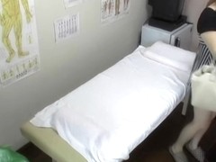 Japanese babe gets fingered during erotic massage session