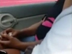 Black streetslut gives a guy head in his car