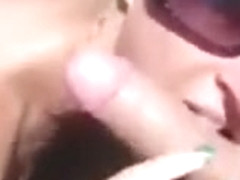 Blonde slut sucks some random dicks at the beach