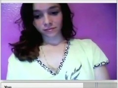 Brunette girl plays with her tits and shaved pussy on her bed