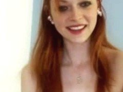 Redhead hottie plays on a webcam