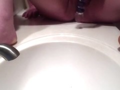 girl squirts in the bathroom sink