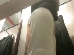 Babe in changing room trying on cloths and getting ass spied