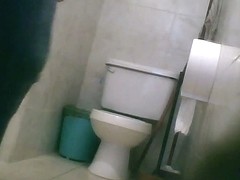 Hidden toilet cam catches chubby Latina chick pissing