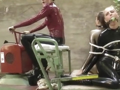 Two Latex Girls Bound And Gagged Outdoors