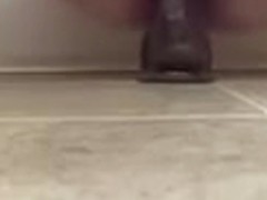 Big dildo suction cupped to the floor
