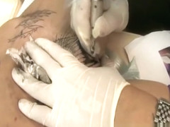 Tabitha gets a tattoo in her pussy
