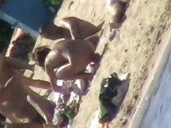 Hot naked red hair chick on nude beach spy camera