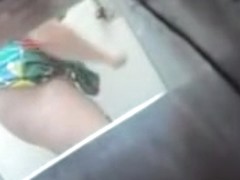 Horny hidden cam masturbation of female with lifted up dress