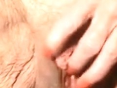 Old depraved woman is finger banging her pretty pink pussy