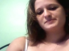 Chubby brunette with big tits masturbates with a dildo on her bed