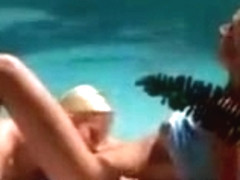 Two blondes have sex by the pool