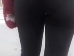 Candid street booty wrapped into tight pants on a cool day