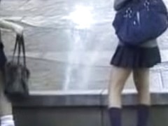 Fountain sharking action with two Asian schoolgirl being in the middle of it