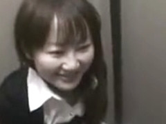 Attractive Japanese babe kneels down and milks a shaft with