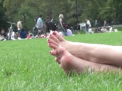 Brown hair model relaxes at the park 4/4